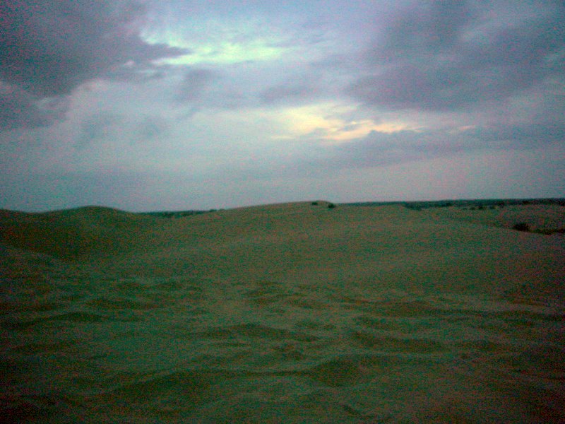 A storm brews over the desert.